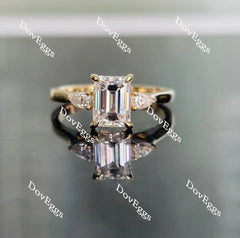 The Ara emerald vintage three stone moissanite ring