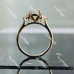 The Ara emerald vintage three stone moissanite ring