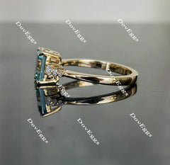 DovEggs peacock blue side stones emerald moissanite engagement ring