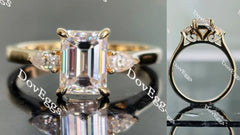 The Ara emerald vintage three stone moissanite ring