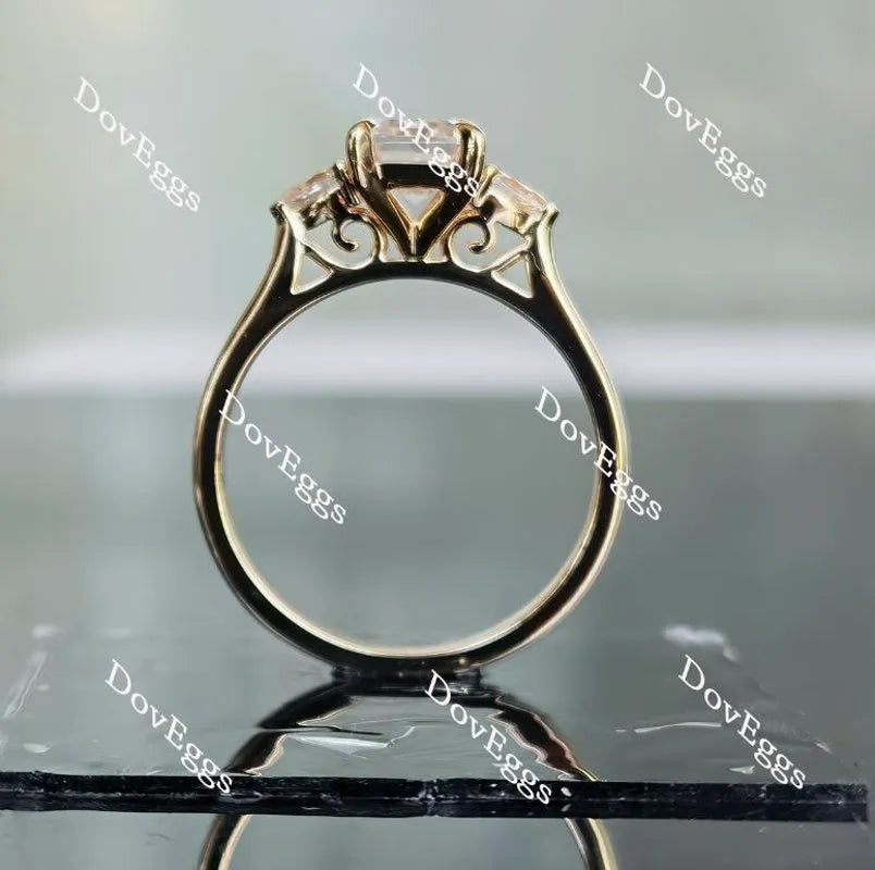 The Ara emerald vintage three stone moissanite ring