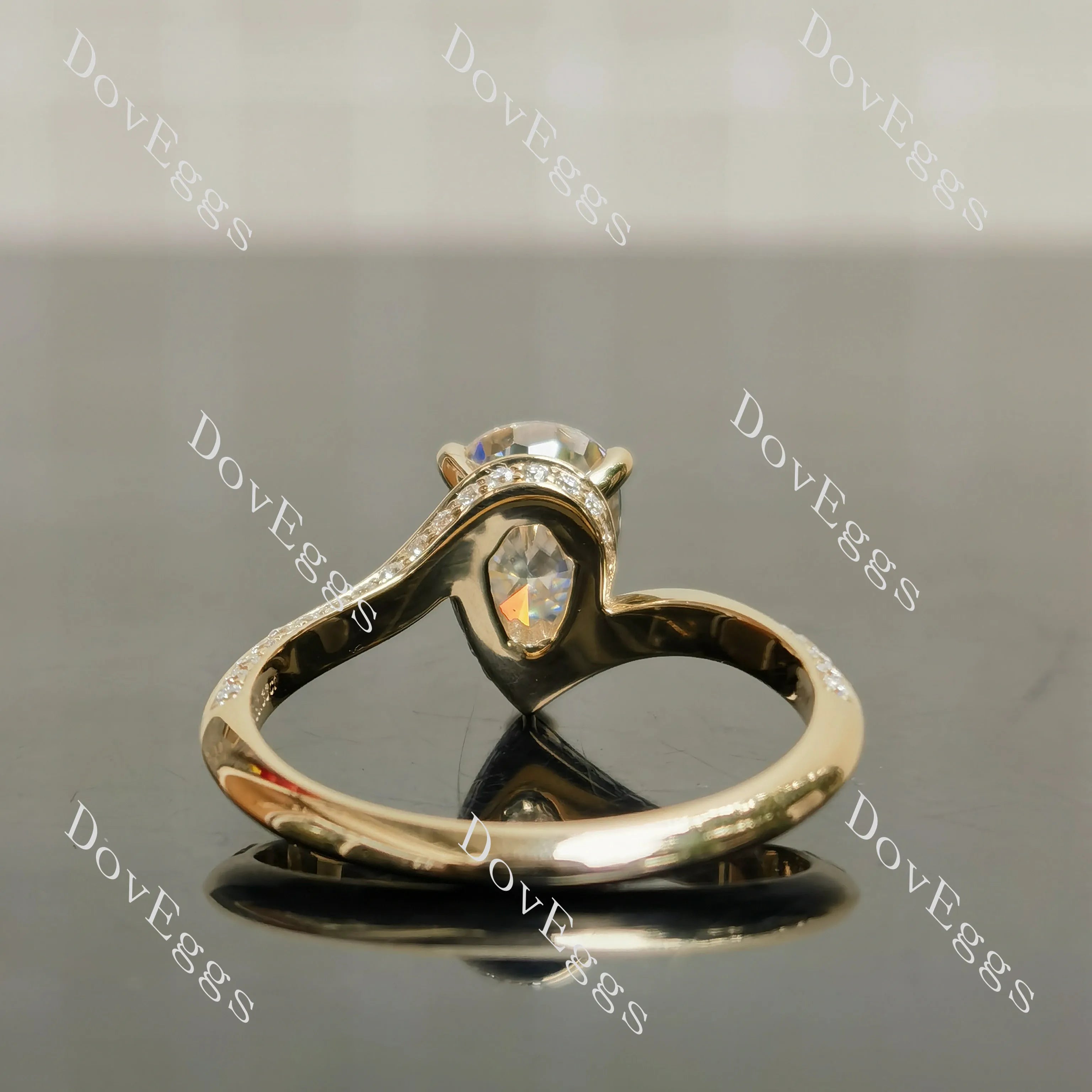 Stephanie’s Promise pear pave channel moissanite engagement ring