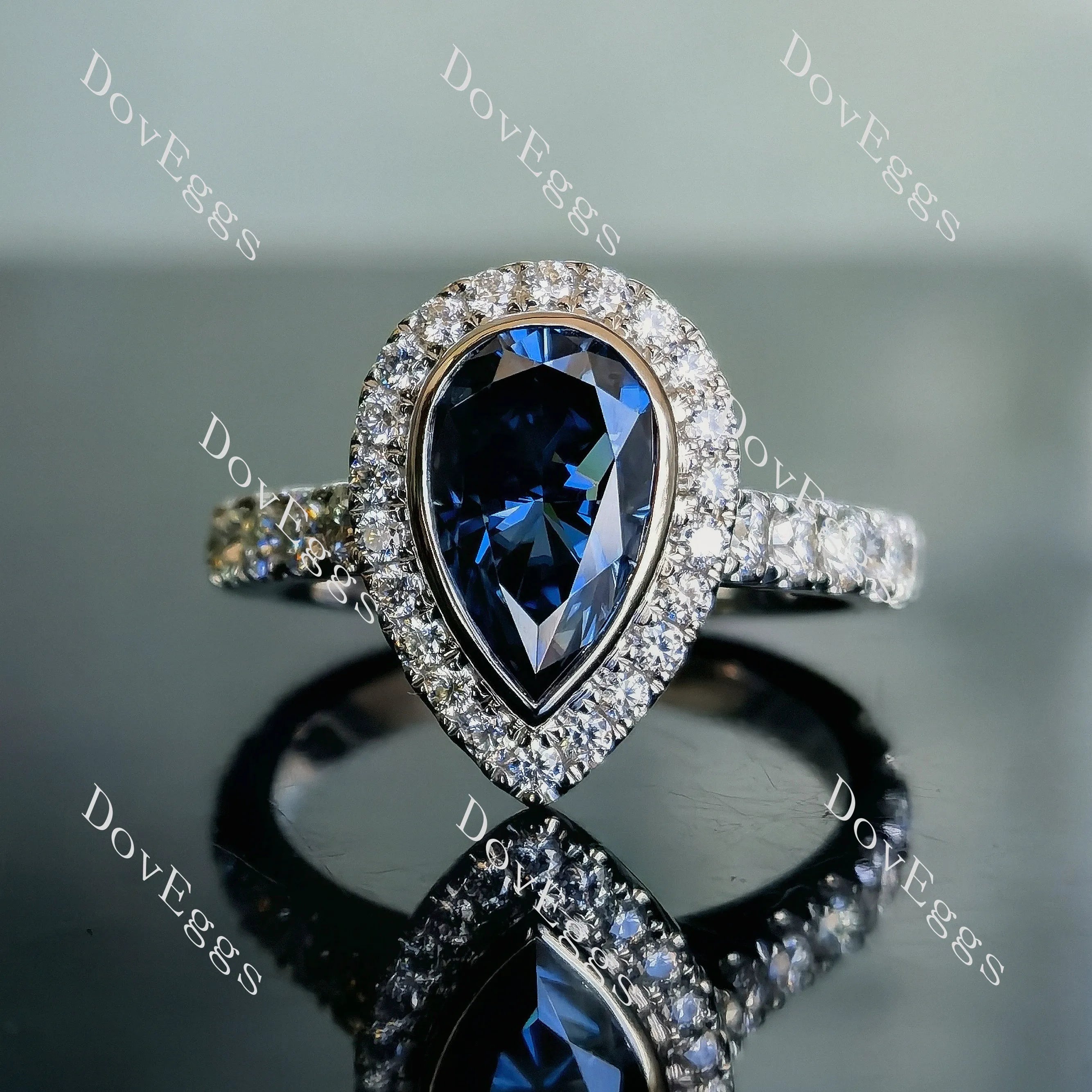 DovEggs pear halo bezel pave twilight blue moissanite engagement ring