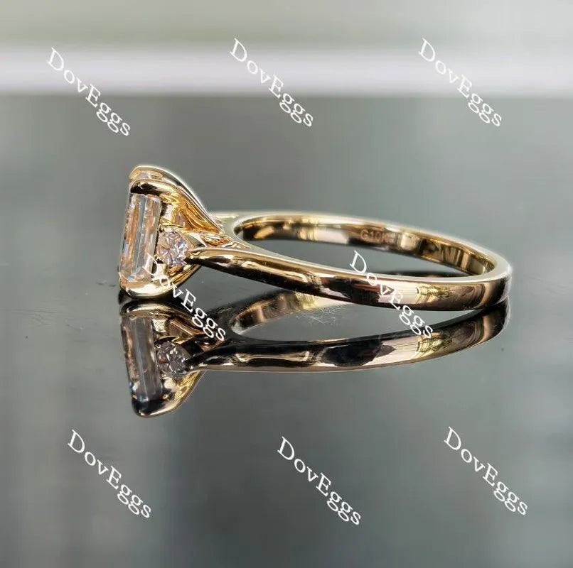 The Ara emerald vintage three stone moissanite ring