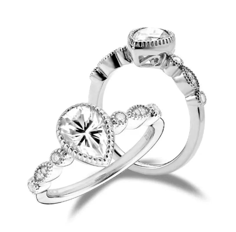 doveggs pear side stone moissanite engagement ring
