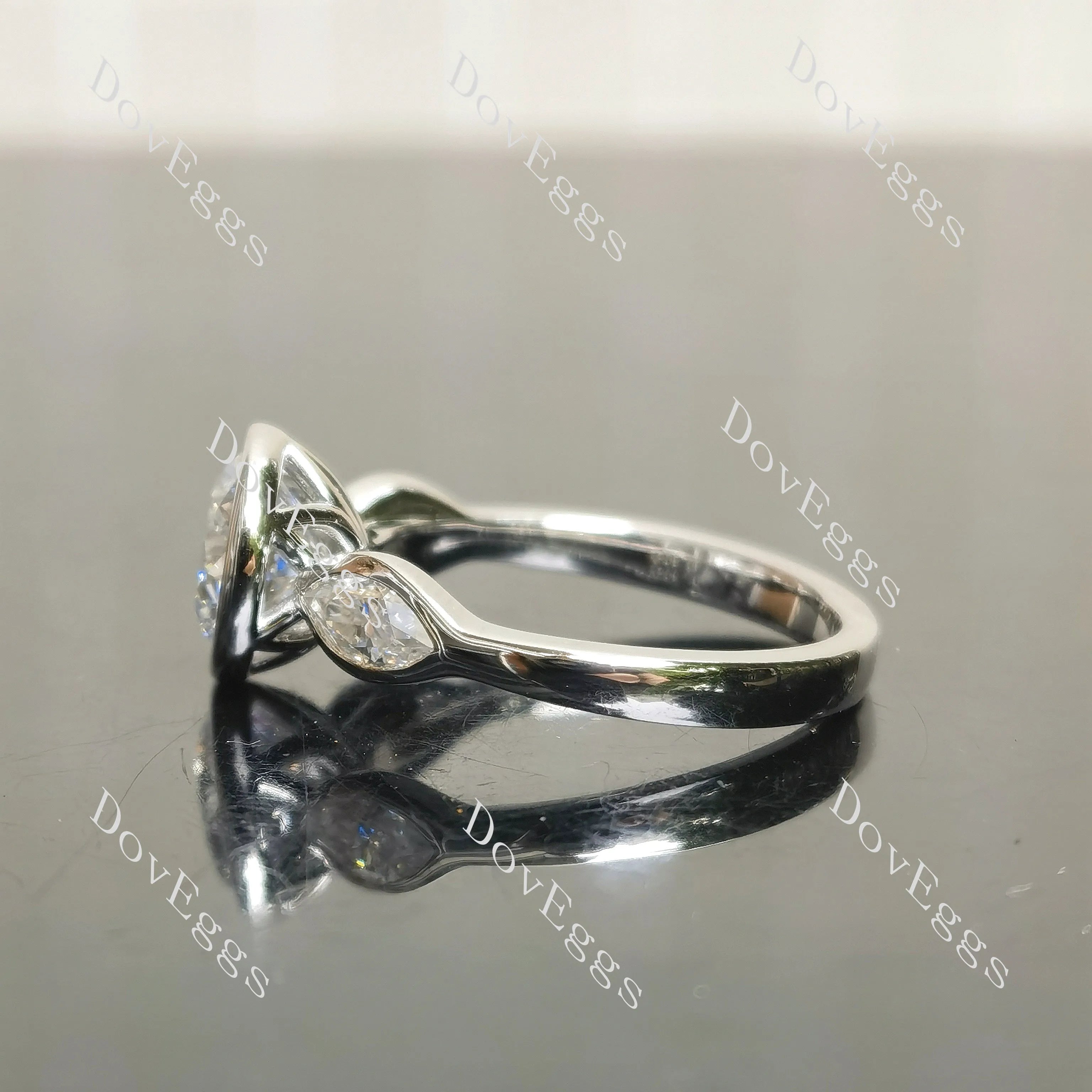 Angelina-Round bezel three stones moissanite engagement ring| DovEggs