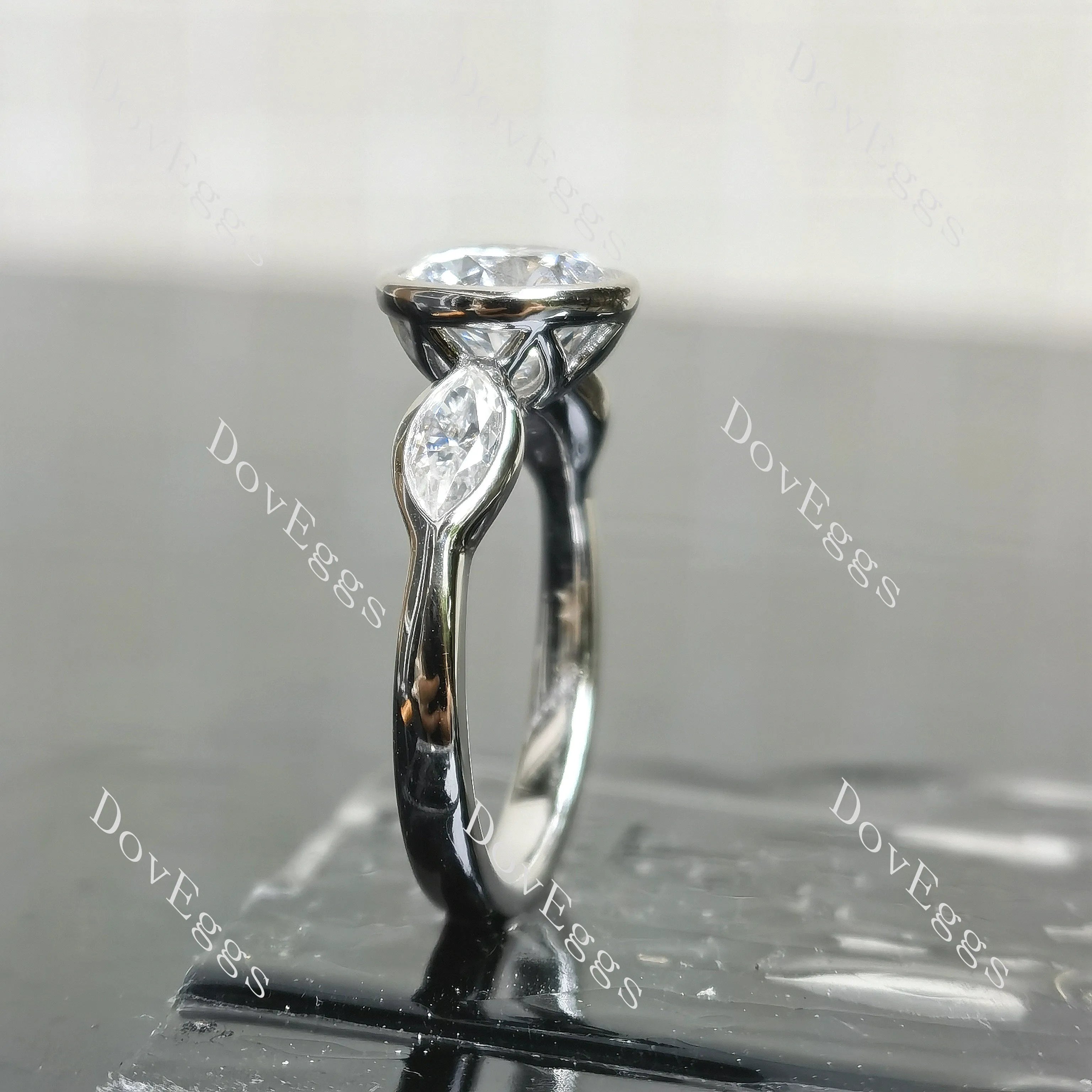 Angelina-Round bezel three stones moissanite engagement ring| DovEggs