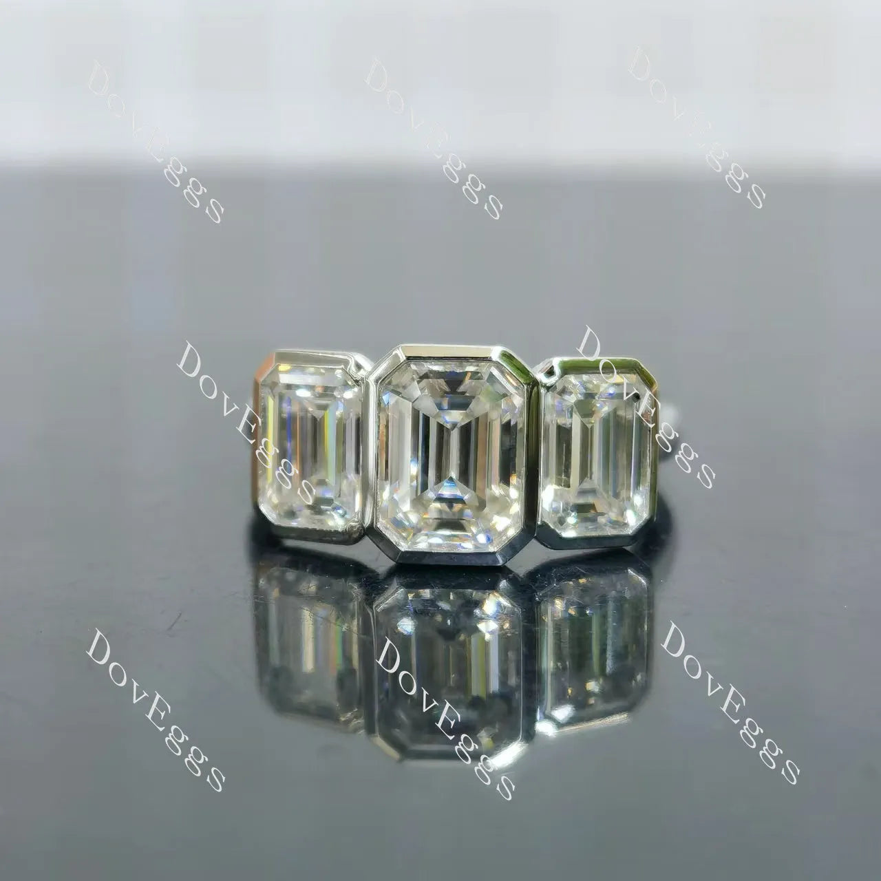 Emerald bezel three stones moissanite engagement ring| DovEggs