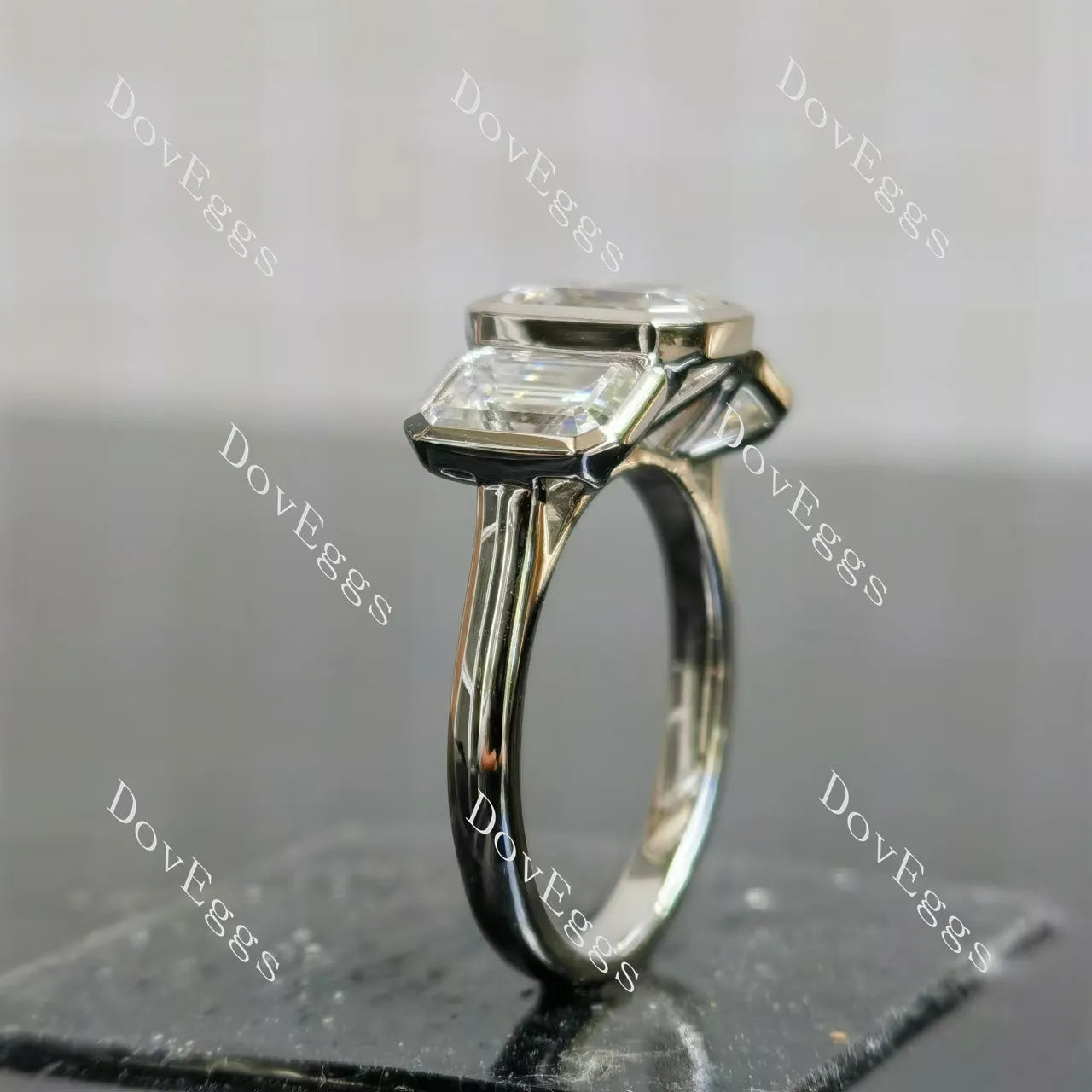 Emerald bezel three stones moissanite engagement ring| DovEggs