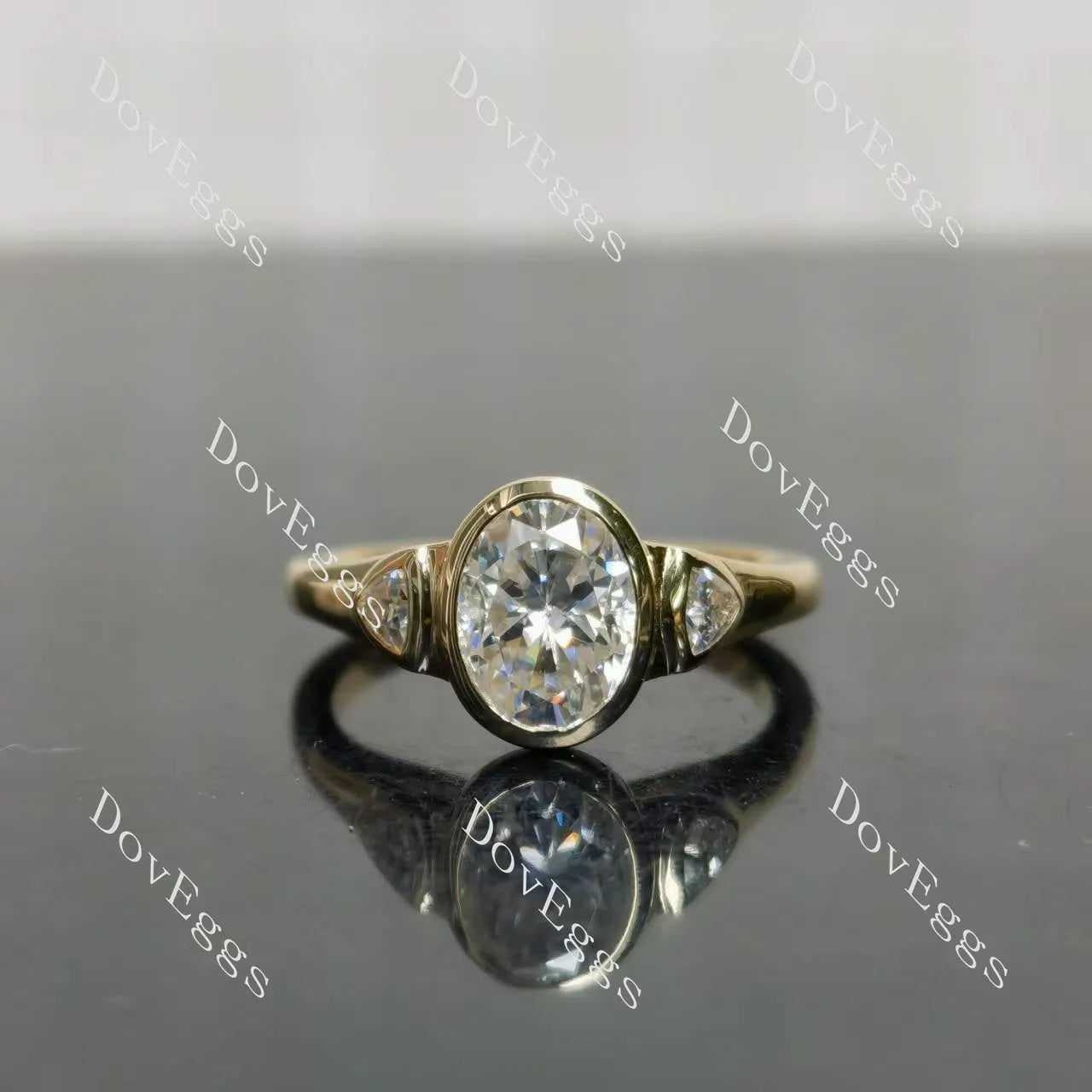 Oval bezel three stones moissanite engagement ring| DovEggs