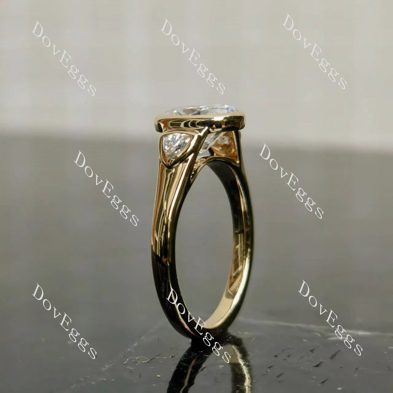 Oval bezel three stones moissanite engagement ring| DovEggs