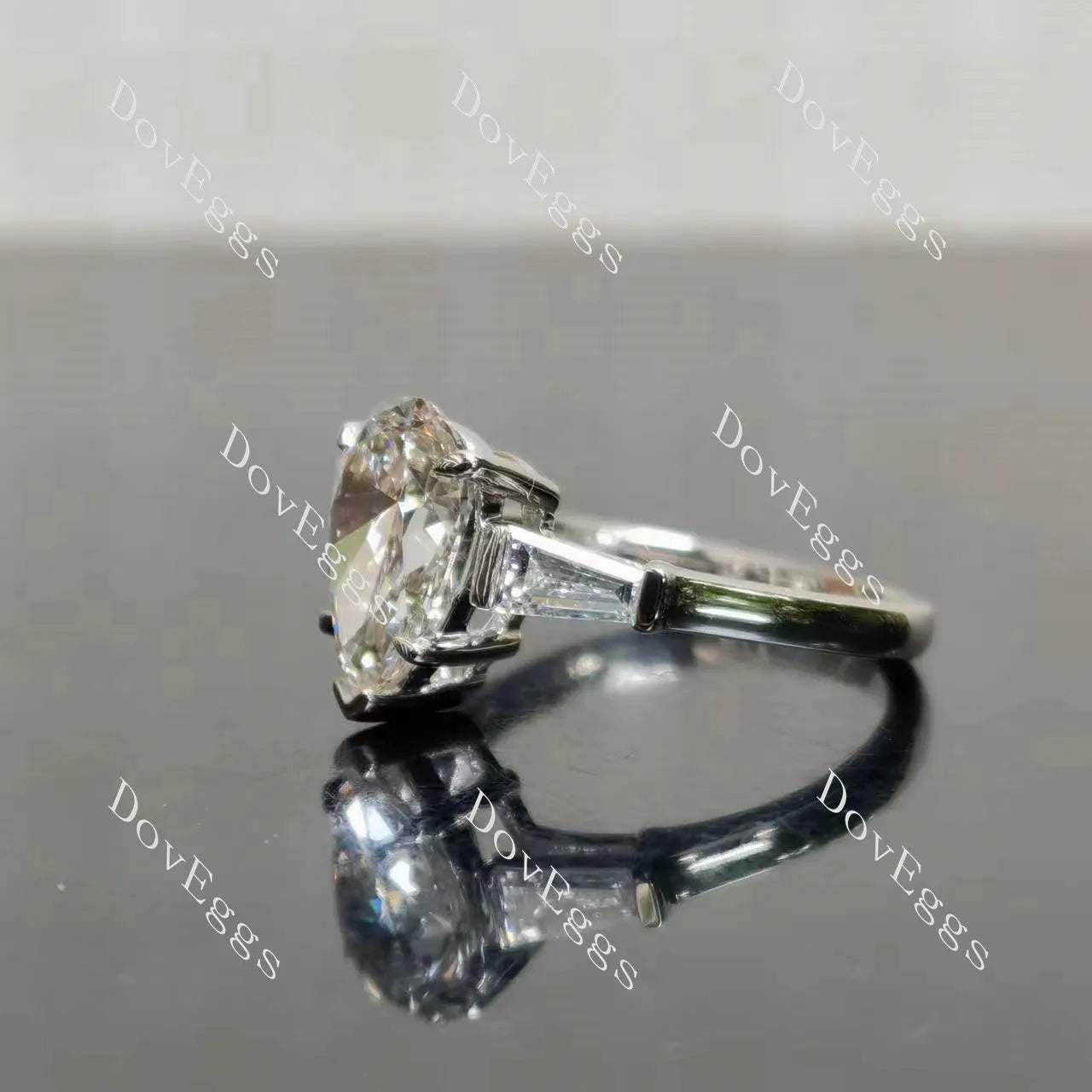 The Maddox-Pear three stones moissanite engagement ring| DovEggs