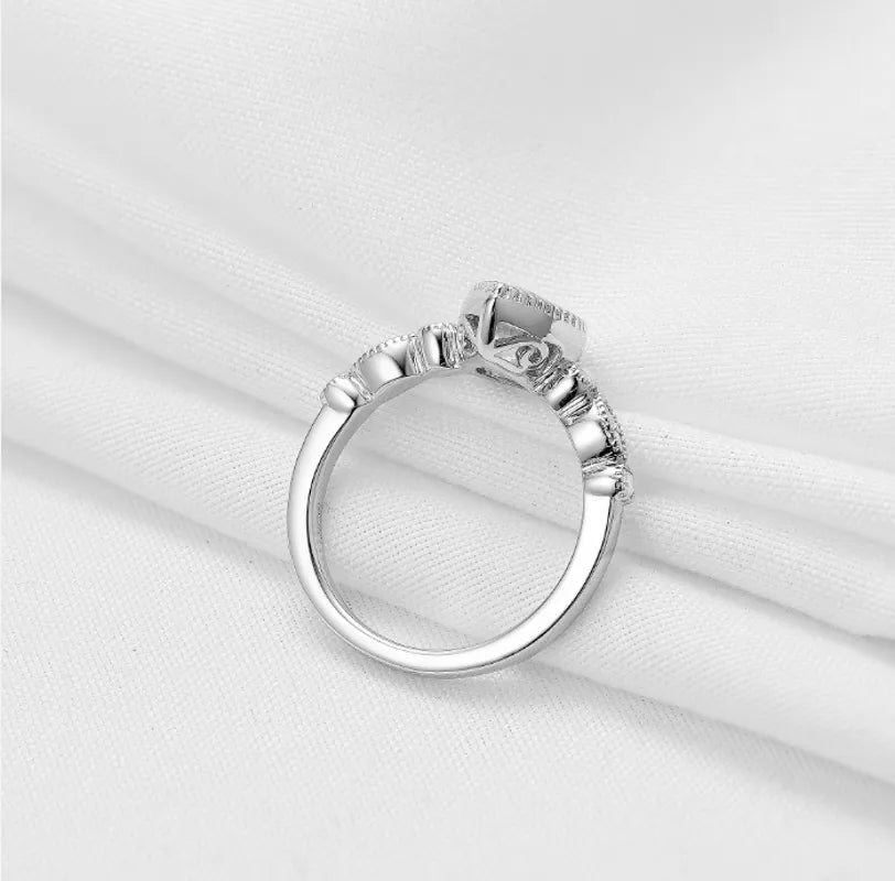 doveggs pear side stone moissanite engagement ring