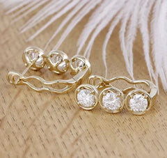 Doveggs three stone round moissanite hoop earrings