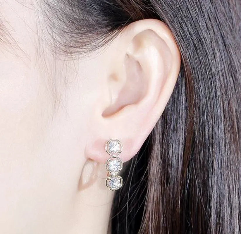 Doveggs three stone round moissanite hoop earrings